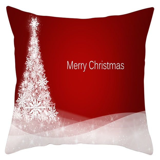 45cm by 45cm red pillowcase with tree made out of snowflaes in a pile of snowdrifts and reads "Merry Christmas"