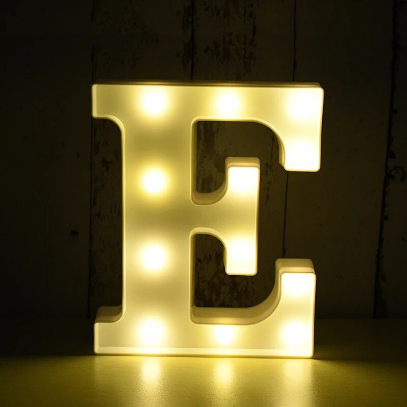 Capital letter E nightlamp illuminated by yellow LED's on a black background