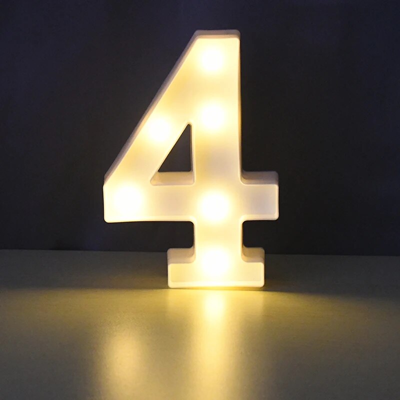 Number 4 nightlamp illuminated by yellow LED's on a black background