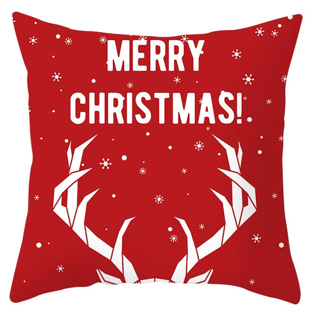 45cm by 45cm red pillowcase with white reindeer antlers and light snow falling that reads"Merry Christmas"