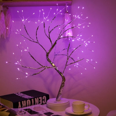 108 pink LED mini Cristmas tree night light on cafe table in dark room