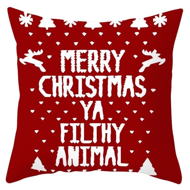 45cm by 45cm red pillowcase with white snowflakes, reindeer, and trees and reads " MERRY CHRISTMAS YA FILTHY ANIMAL"