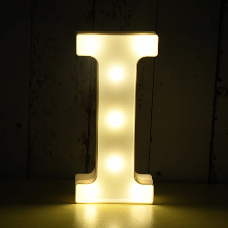 Capital letter I nightlamp illuminated by yellow LED's on a black background