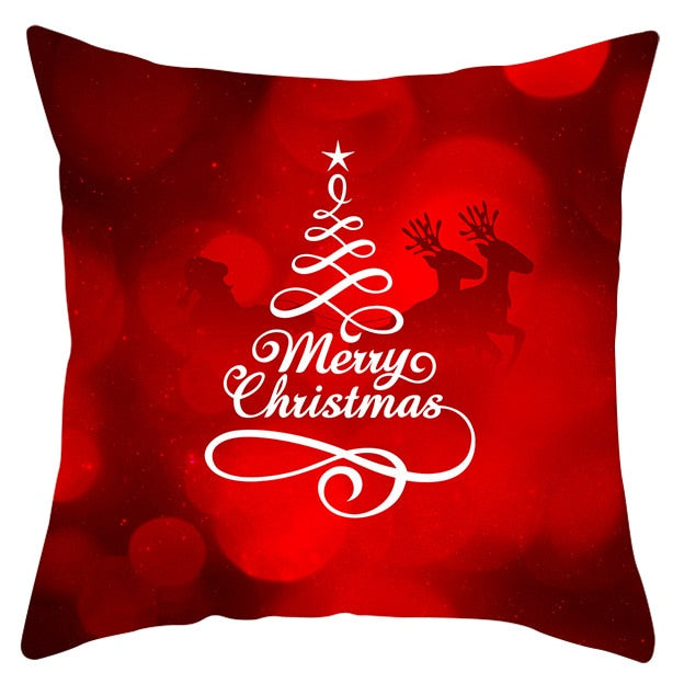 45cm by 45cm red pillowcase with white tree with dark red reindeer in the background that reads "Merry Christmas"