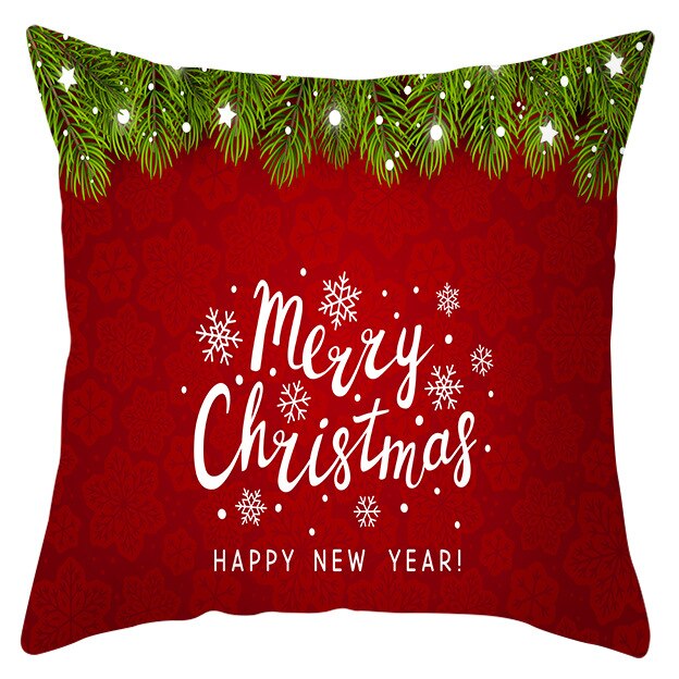 45cm by 45cm red pillowcase with evergreen garland at the top and the words " Merry Christmas HAPPY NEW YEAR" below