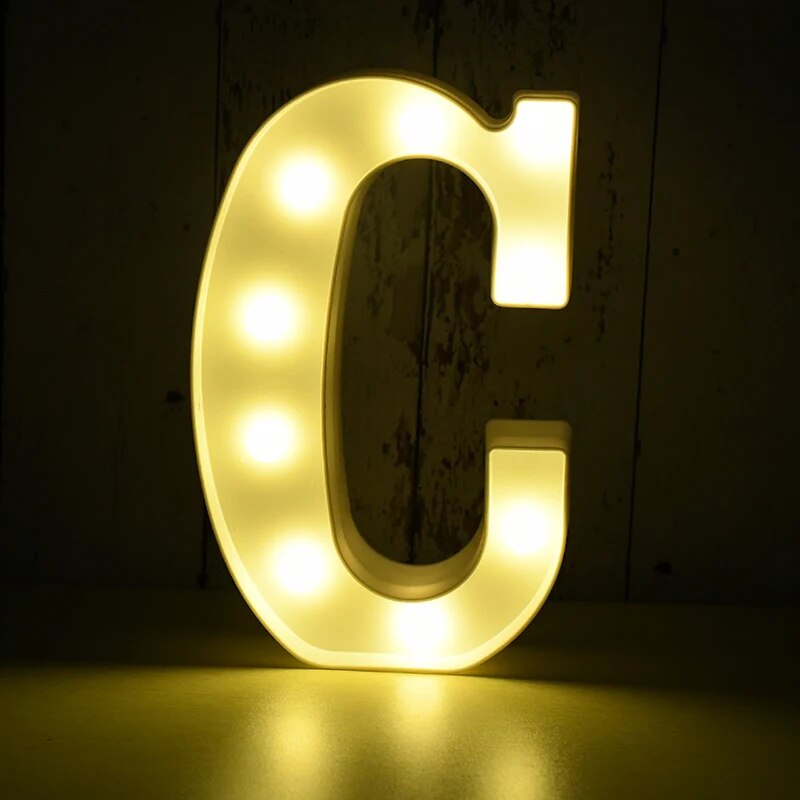 Capital letter C nightlamp illuminated by yellow LED's on a black background