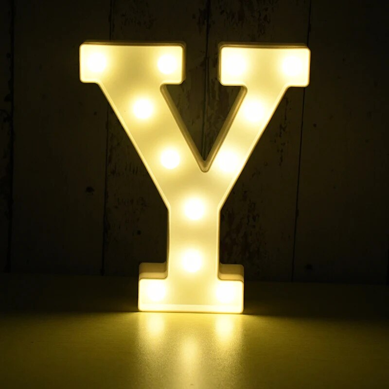 Capital letter Y nightlamp illuminated by yellow LED's on a black background