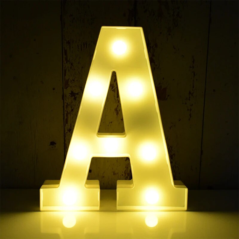 Capital letter A nightlamp illuminated by yellow LED's on a black background