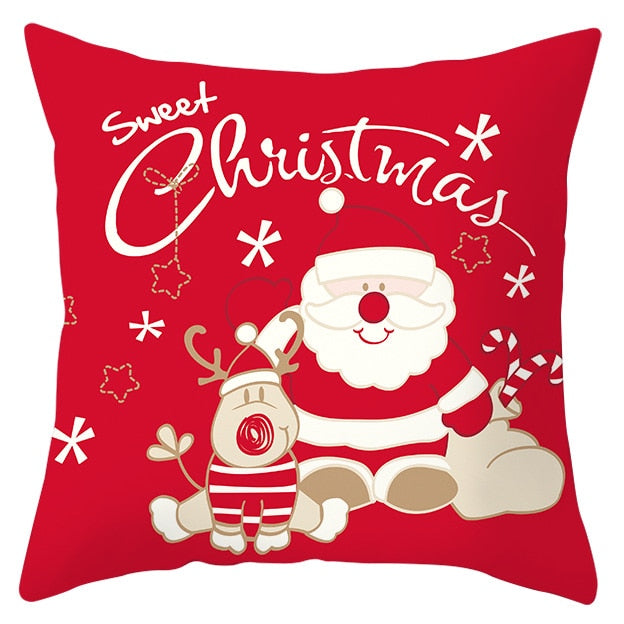 45cm by 45cm red pillowcase with Santa sitting with baby reindeer and Says"Sweet Christmas"