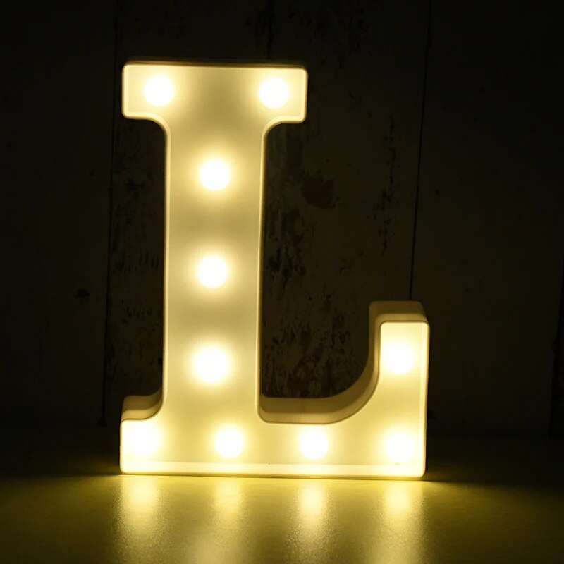 Capital letter L nightlamp illuminated by yellow LED's on a black background