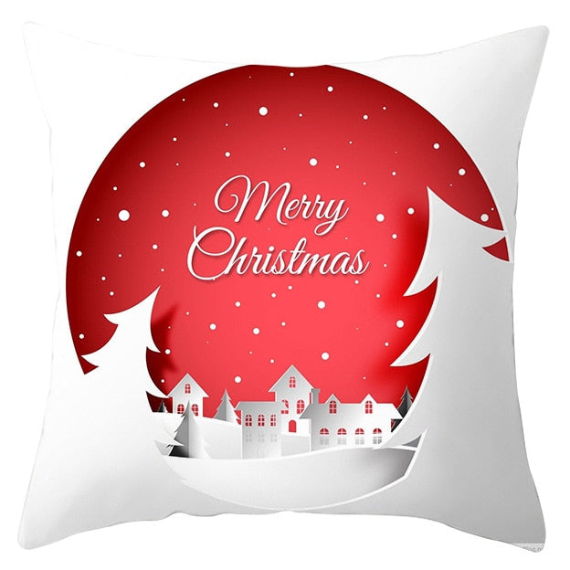 45cm by 45cm red and white pillowcase with snow covered trees and neighborhood and reads "Merry Christmas"