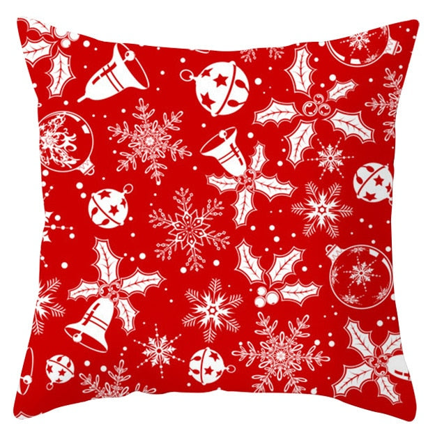 45cm by 45cm red pillowcase with white ornaments, bells, snowflakes, and holly leaves with berries