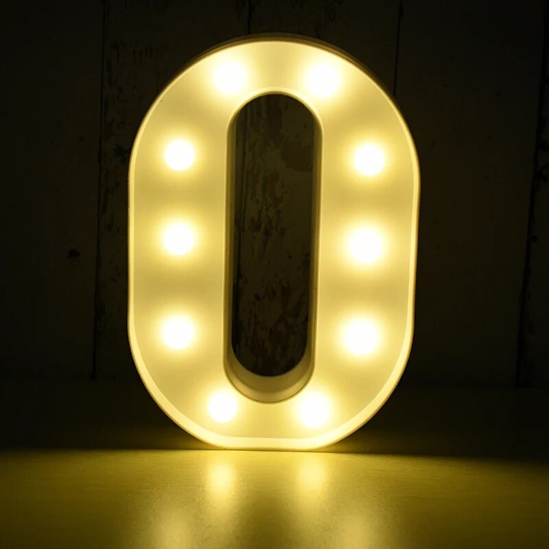 Capital letter O nightlamp illuminated by yellow LED's on a black background