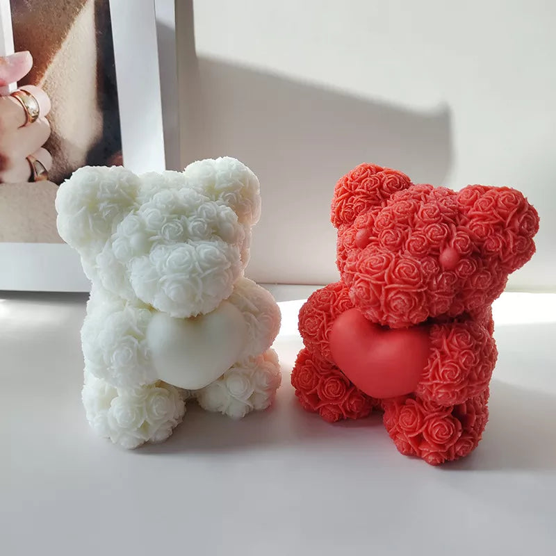 Red and white chocolate molded bears on white background