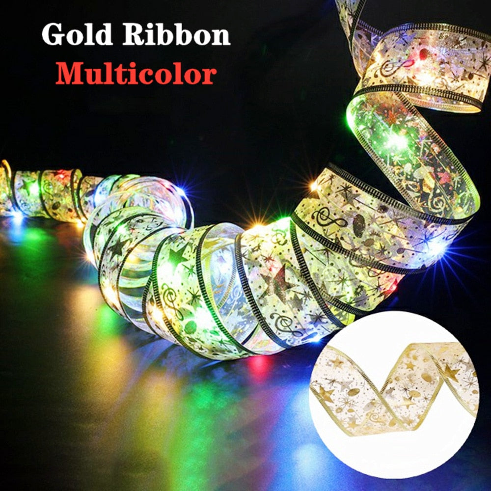 Coil of multicolor lit gold ribbon in a dark room