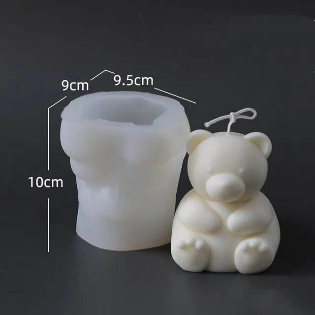 One white chocolate molded bear on black background with mold size dimension