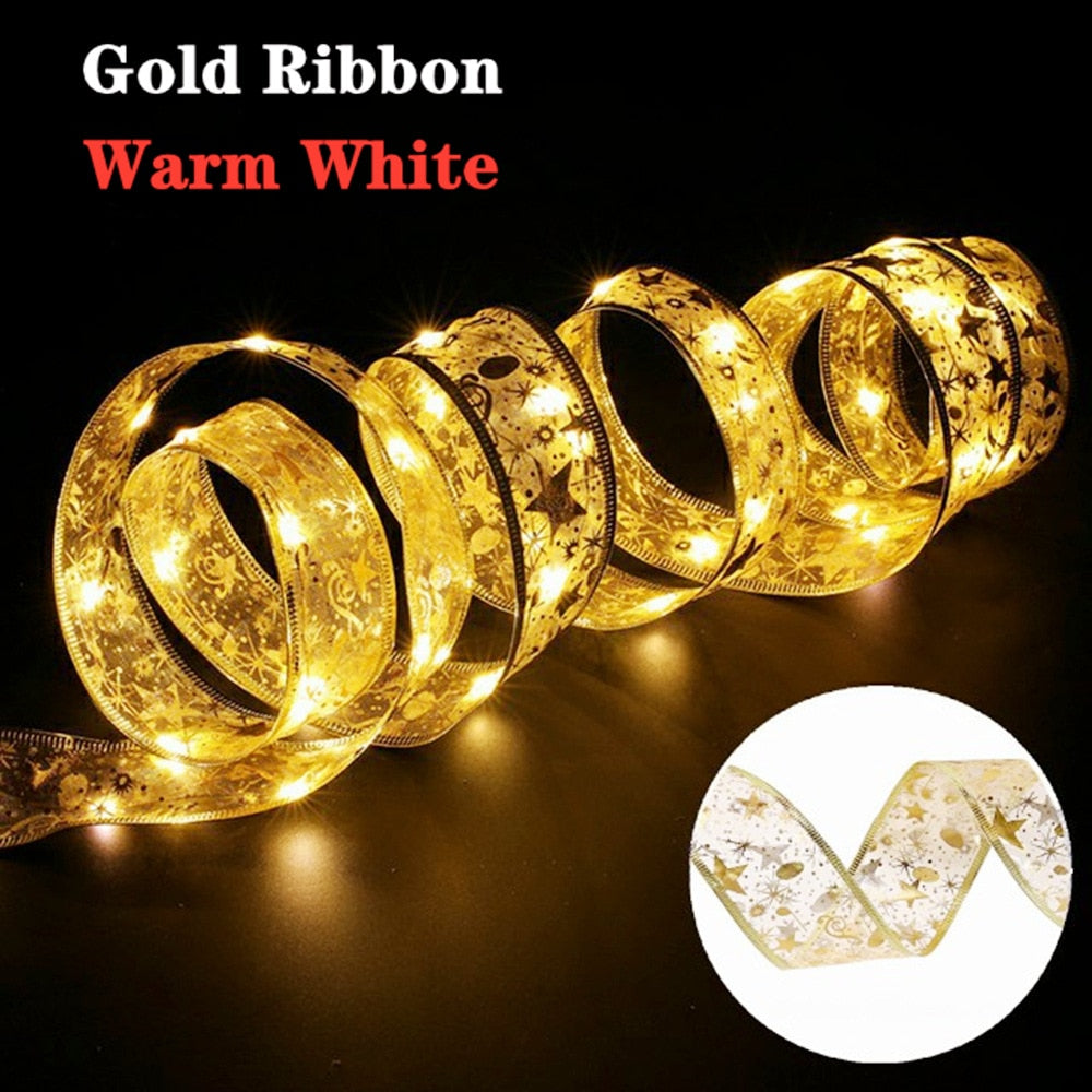 Coil of illuminated warm white gold ribbon in a dark room