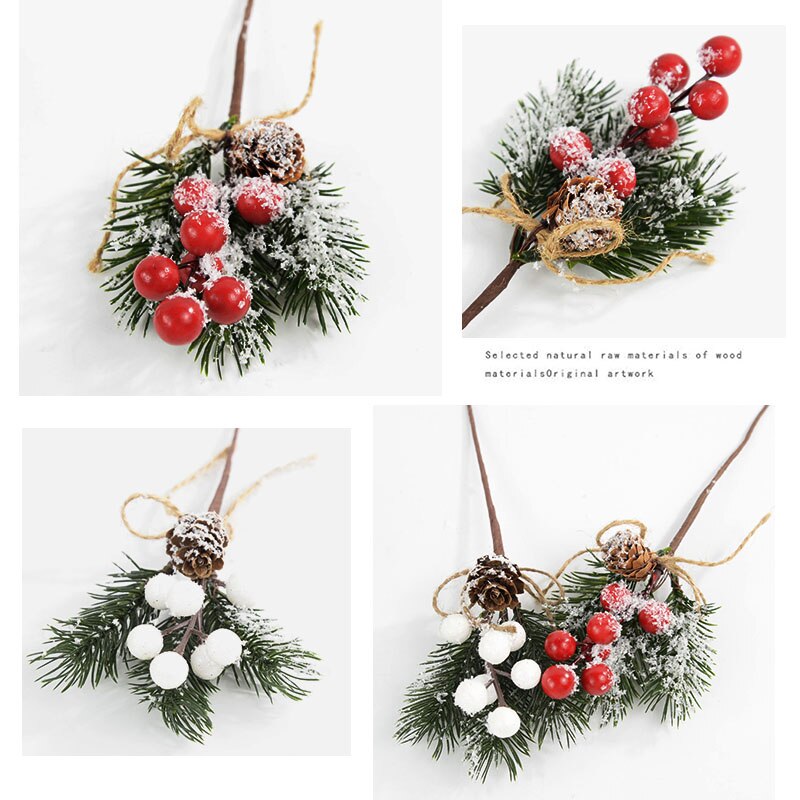 Four close up of 22cm by 7.5cm artificial wreathe/garland addition with 3 snowdusted evergreen leaves, a light brown pine cone with red berries and the same pieces with white berries on a white background.