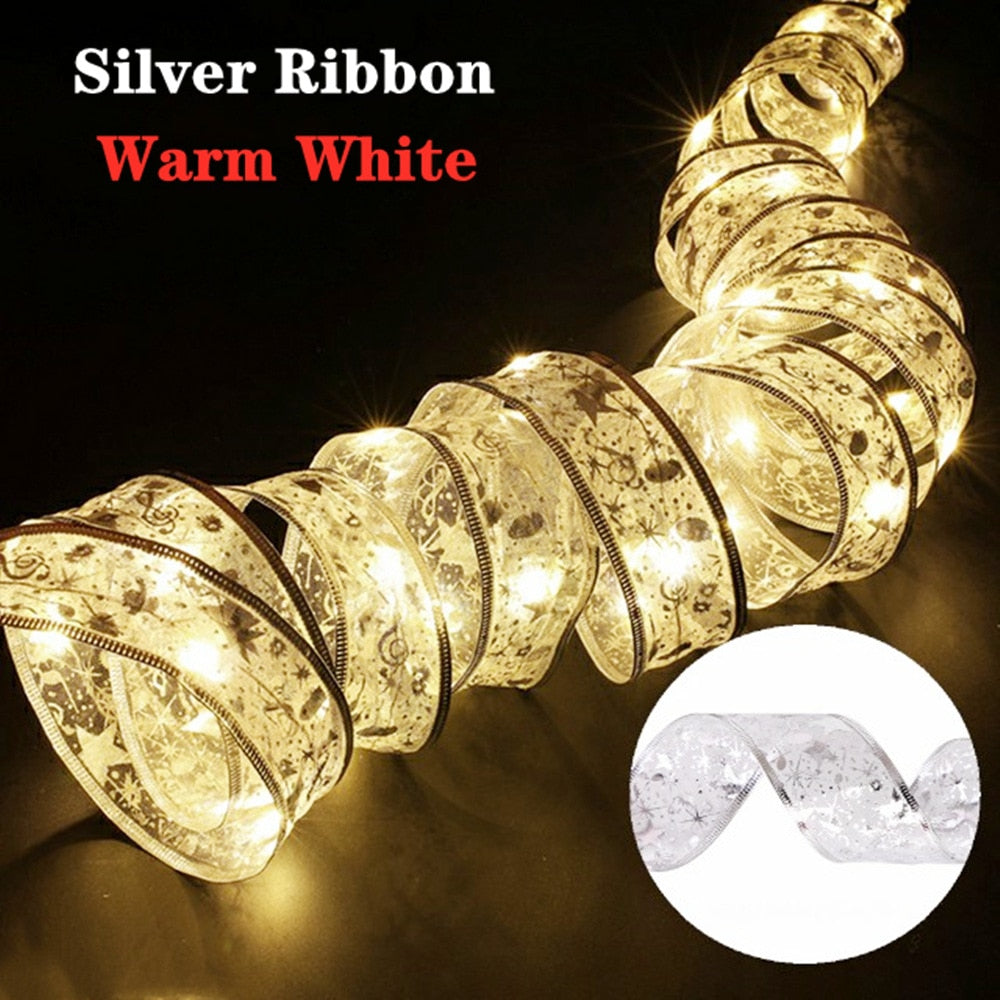 Coil of white illuminated gold ribbon in a dark room