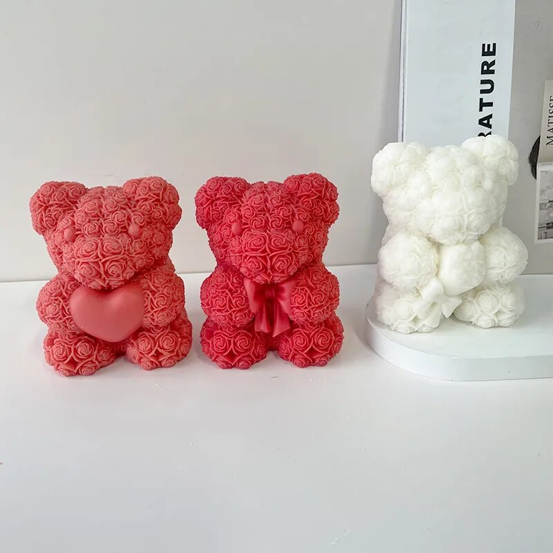  Two red and one white chocolate molded bears on white background