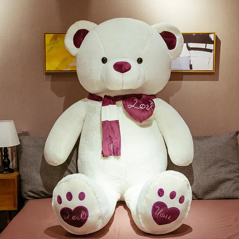  Large white teddy bear wearing brown scarf with brown ears, nose and bottom paw prints