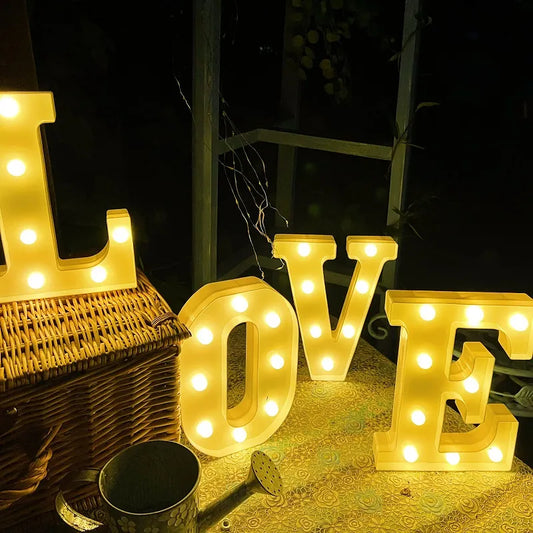 16cm yellow LED lights arranged to read LOVE on black background