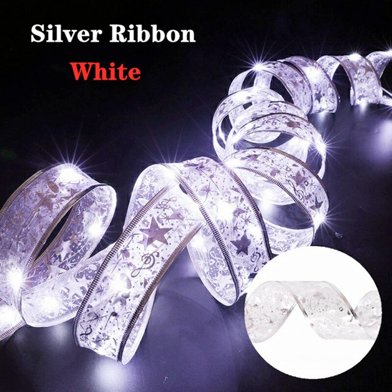 Coil of white illuminated silver ribbon in a dark room