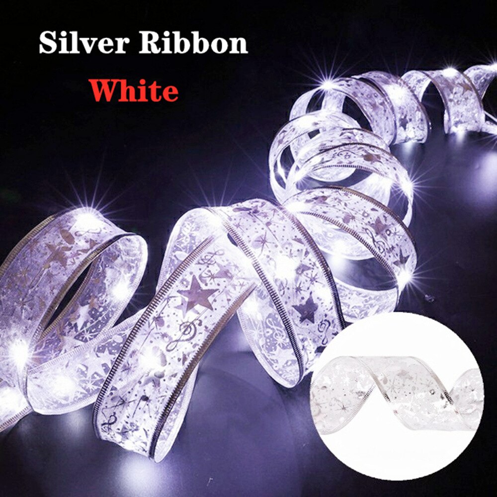 Coil of illuminated white silver ribbon in a dark room