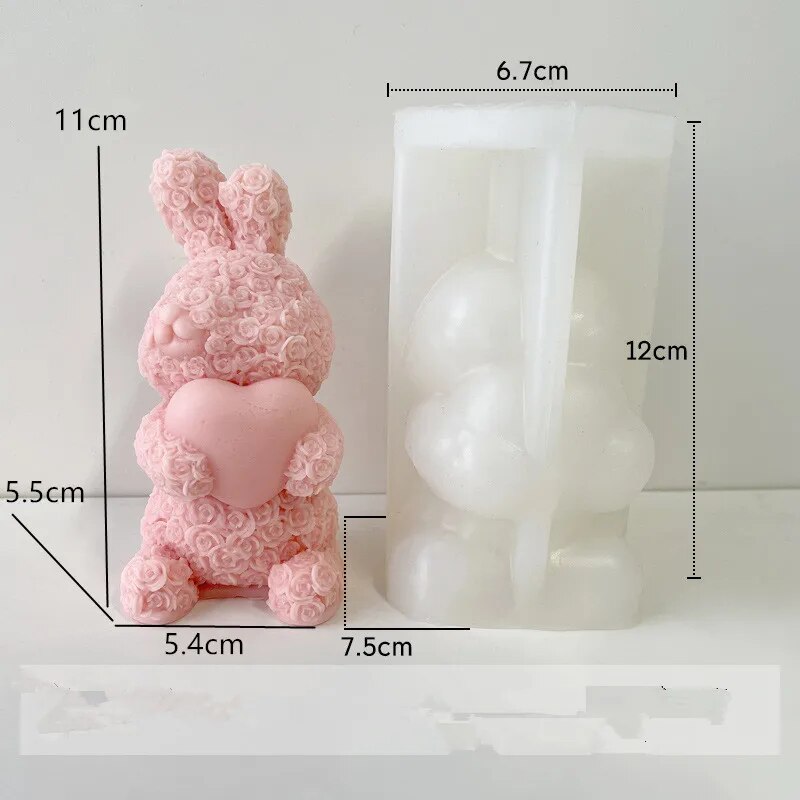 One pink colored chocolate molded bunny on white background with mold size dimension