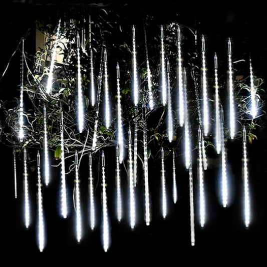 White outdoor Christmas meteor shower LED's hung in black background