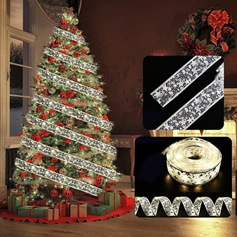 Large artificial tree wrapped with warm illuminated white silver ribbon