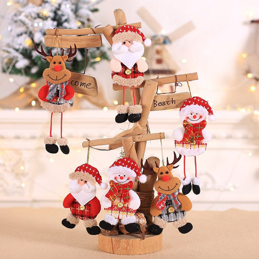 Reindeer, Santa, and snowman Christmas tree pendant hanging off handmade wood artificial tree